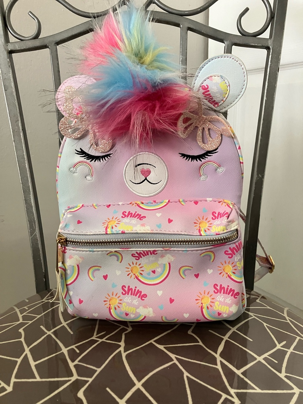 Under One Sky Kids Mini Backpack with pastel tie-dye colors and faux-fur pompom